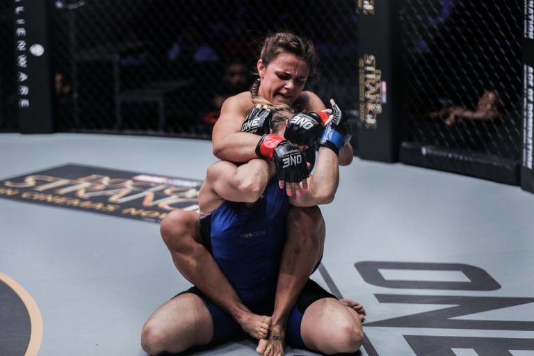 Eight-time Brazilian Jiu-Jitsu World Champion Michelle Nicolini sets up the rear-naked choke