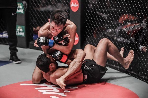 Japanese mixed martial artist Yoshitaka Naito attempts an armbar in his debut
