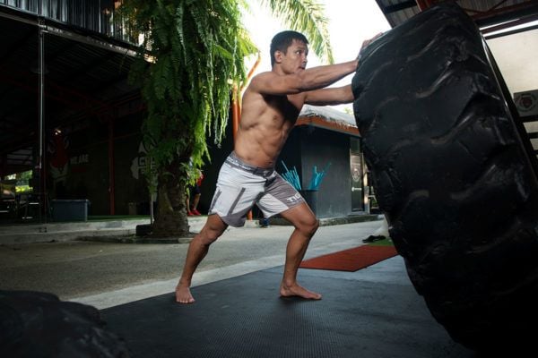 Russian knockout artist Timofey Nastyukhin pushes a tire at Tiger Muay Thai in Phuket