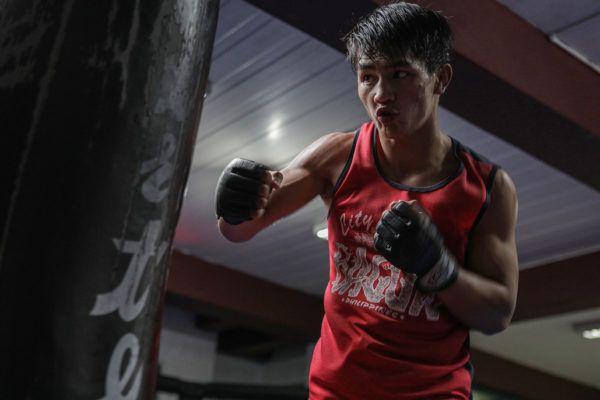 Flyweight mixed martial artist Danny Kingad punches a heavy bag