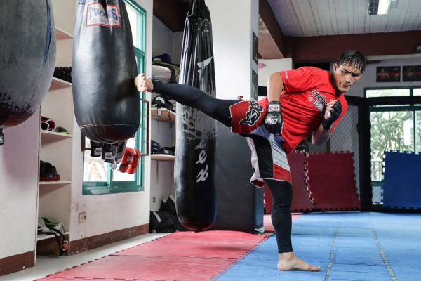 Former ONE Lightweight World Champion Eduard Folayang kicks the bag