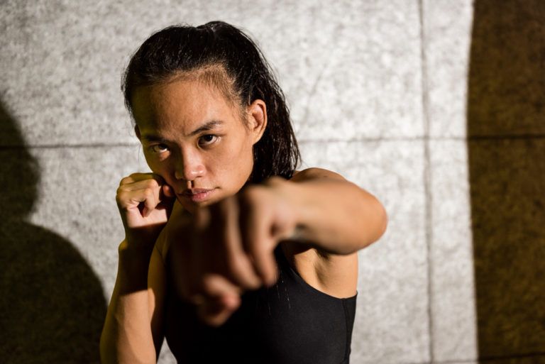 Tiffany Teo throws a punch