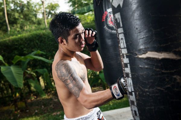 Thai strawweight Pongsiri Mitsatit hits the heavy bag at Tiger Muay Thai in Phuket, Thailand