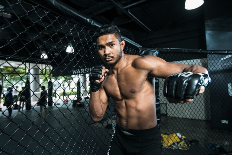 Singaporean mixed martial arts star Amir Khan poses for a shoot at Evolve MMA
