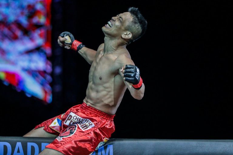 Filipino MMA fighter Edward Kelly celebrates a victory