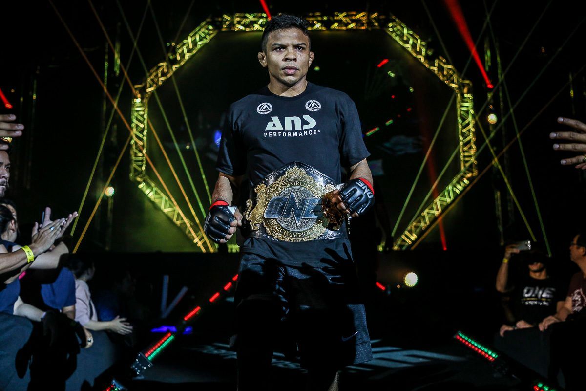 Bibiano Fernandes with the ONE Bantamweight World Title belt