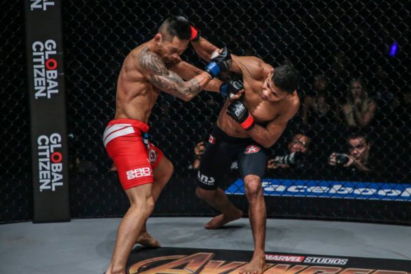 ONE Bantamweight World Champion Bibiano Fernandes connects with a cross on Martin Nguyen