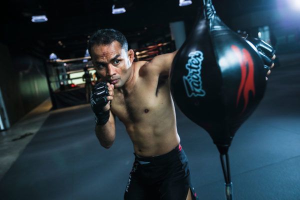 Former ONE Strawweight World Champion Dejdamrong Sor Amnuaysirichoke punches the bag at Evolve MMA in Singapore