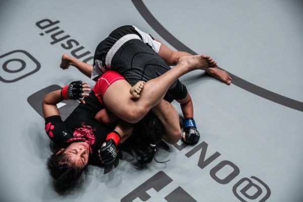 Malaysian mixed martial artist Jihin Radzuan secures a triangle choke on Puja Tomar
