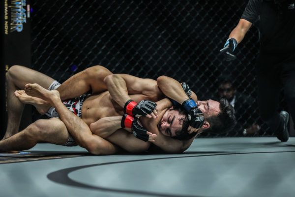 Chinese hero Ma Jia Wen locks in a rear-naked choke, but applies pressure on the jaw