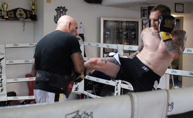 Elliot Compton kicks the pads