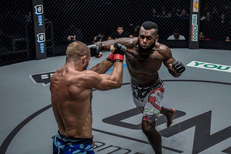 Brazil's Leandro Ataides hits a superman punch on Vitaly Bigdash