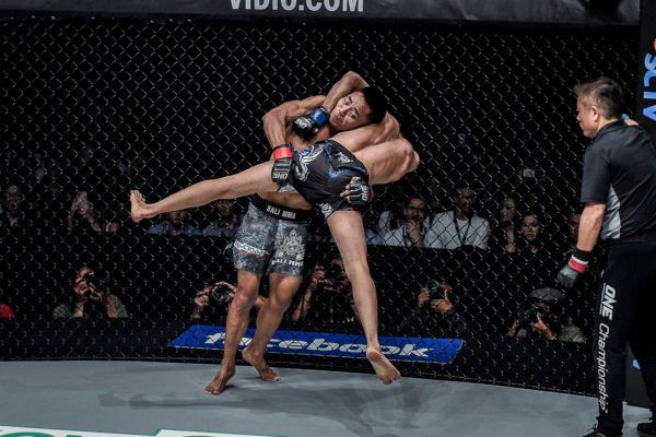 Indonesian mixed martial artist Stefer Rahardian hits a big takedown