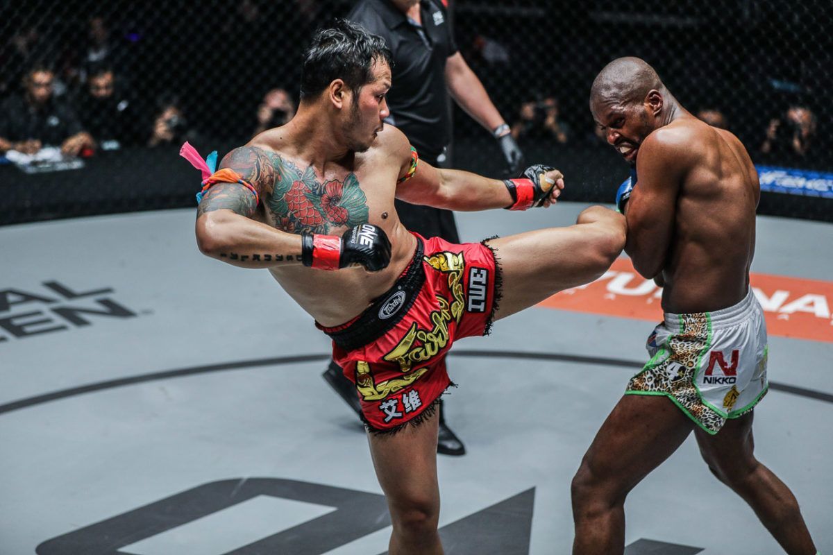 Muay Thai and kickboxing star Yodsanklai IWE Fairtex displays his trademark left kick on Chris Ngimbi