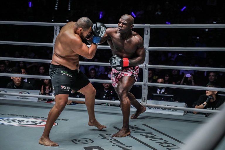 Hong Kong-based mixed martial artist Alain "The Panther" Ngalani punches Tarik Khbabez with a cross punch