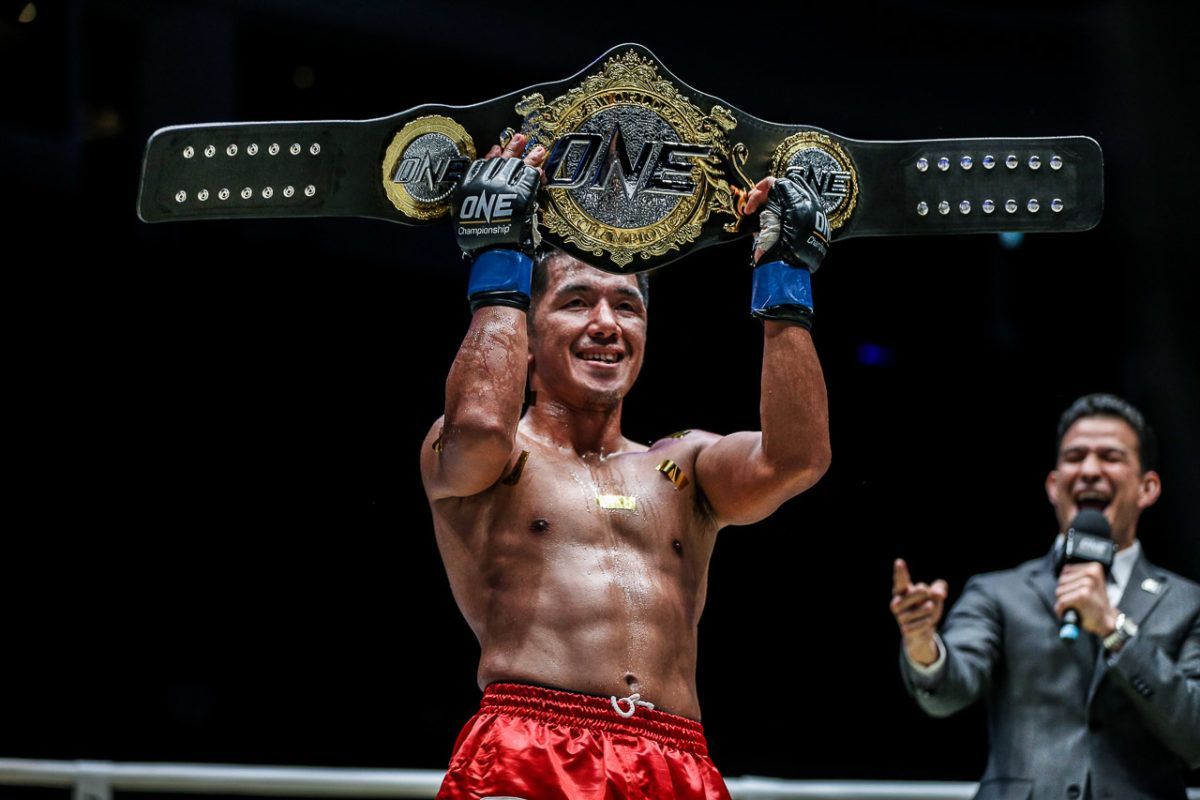 Geje Eustaquio with the ONE Championship World Title Belt