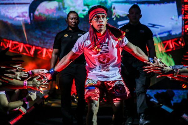 Filipino MMA star Kevin Belingon enters the arena