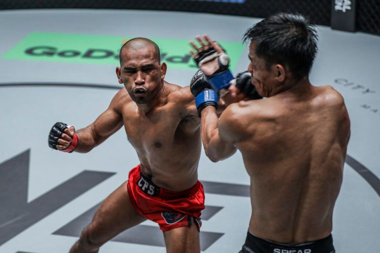 Philippine martial artist Rene Catalan leaps forward with a punch