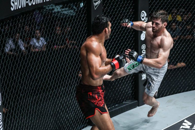 American MMA fighter Tyler McGuire jumps off the Circle with a flying punch