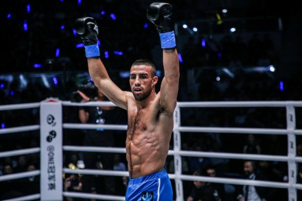 Italian kickboxer Mustapha Haida raises his arms in the ring