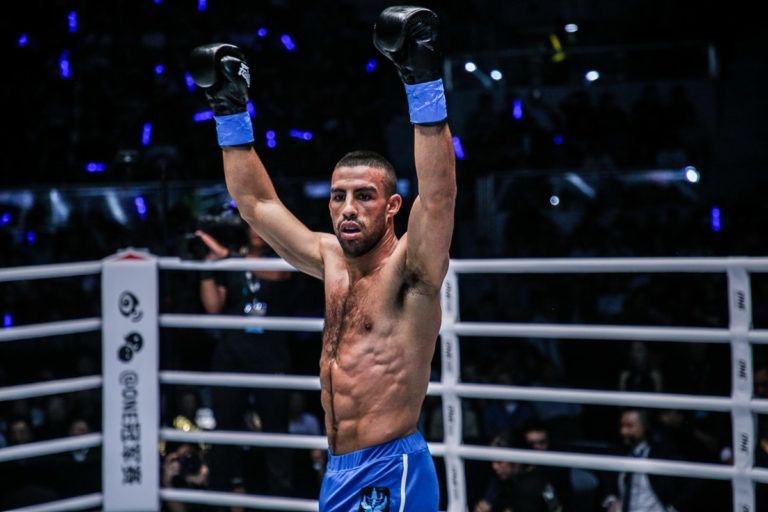 Italian kickboxer Mustapha Haida raises his arms in the ring