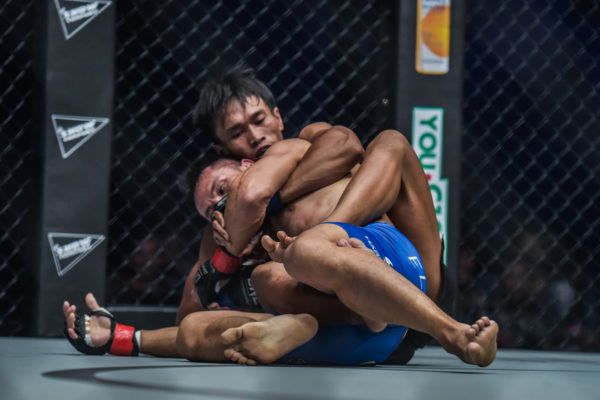 Sunoto works to sink in a rear-naked choke at ONE: CONQUEST OF HEROES against Victorio Senduk.