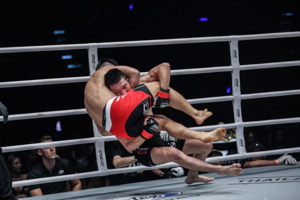 Japanese MMA fighter hits a takedown on Ev Ting
