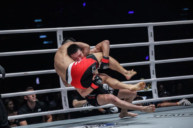 Japanese MMA fighter hits a takedown on Ev Ting