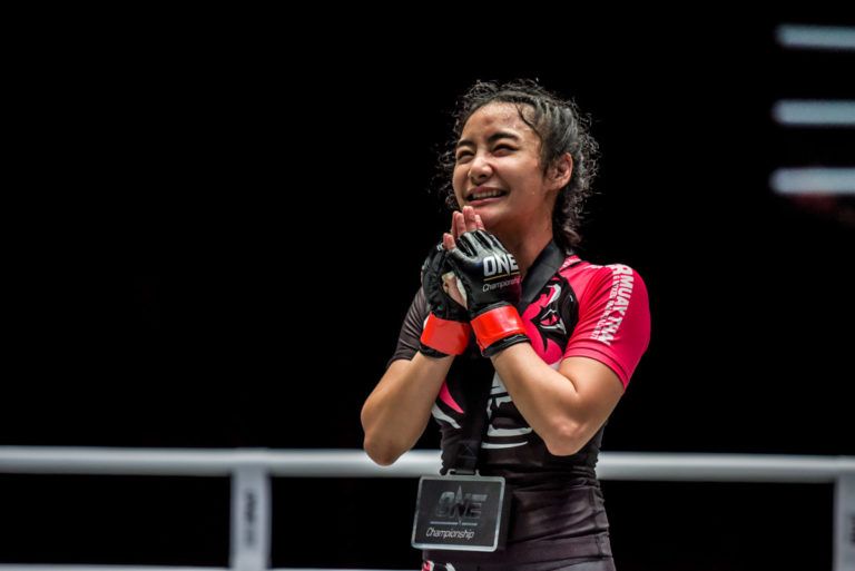 Thai mixed martial artist Rika Ishige poses following her victory