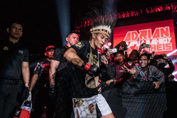 Indonesian mixed martial artist Adrian Mattheis displays some swagger on the way to the ring