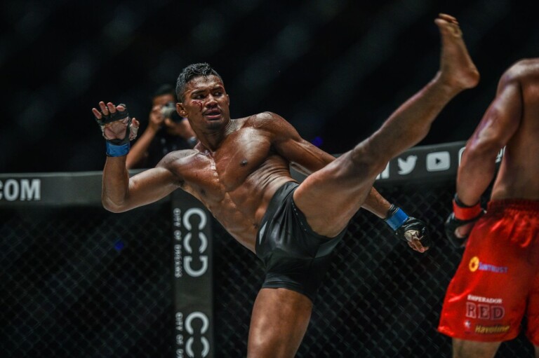 Singapore Muay Thai Champion Amir Khan throws a head kick