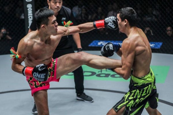Muay Thai fighter Saemapetch Fairtex kicks and punches Alaverdi Ramazonov