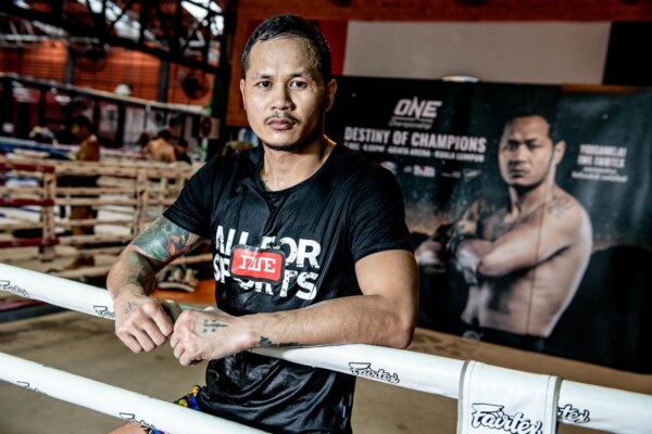Muay Thai legend Yodsanklai IWE Fairtex stands in the ring