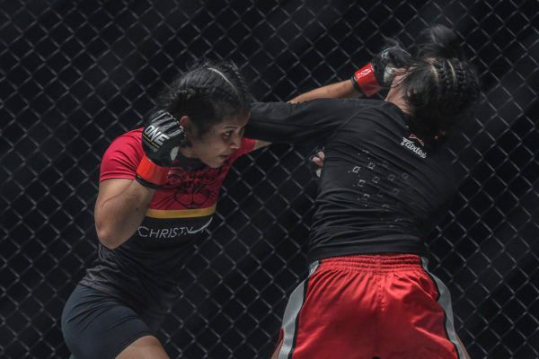 Malaysian mixed martial artist Jihin Radzuan lands a cross from southpaw