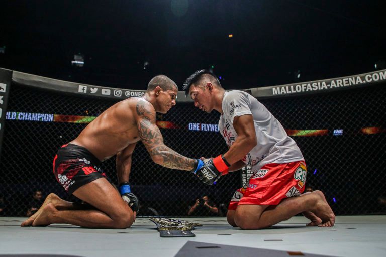 Flyweight mixed martial artist Adriano Moraes and Geje Eustaquio show respect to each other following their battle