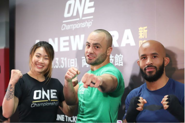 Eddie Alvarez with Angela Lee and Demetrious Johnson at the 'A New Era' Press Con in Japan