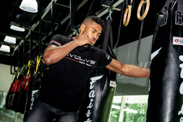 Singapore martial artist Amir Khan punches the heavy bag at Evolve