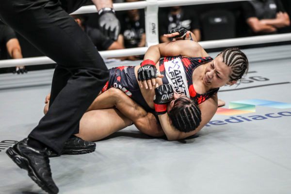 Japanese mixed martial artist Ayaka Miura secures a scarfhold Americana