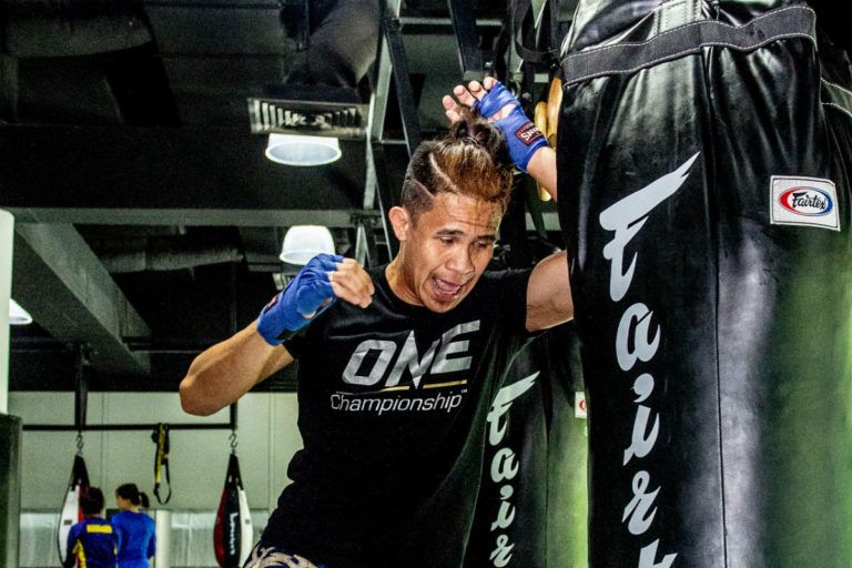 Filipino striker Jeremy Miado smashes the heavy bag