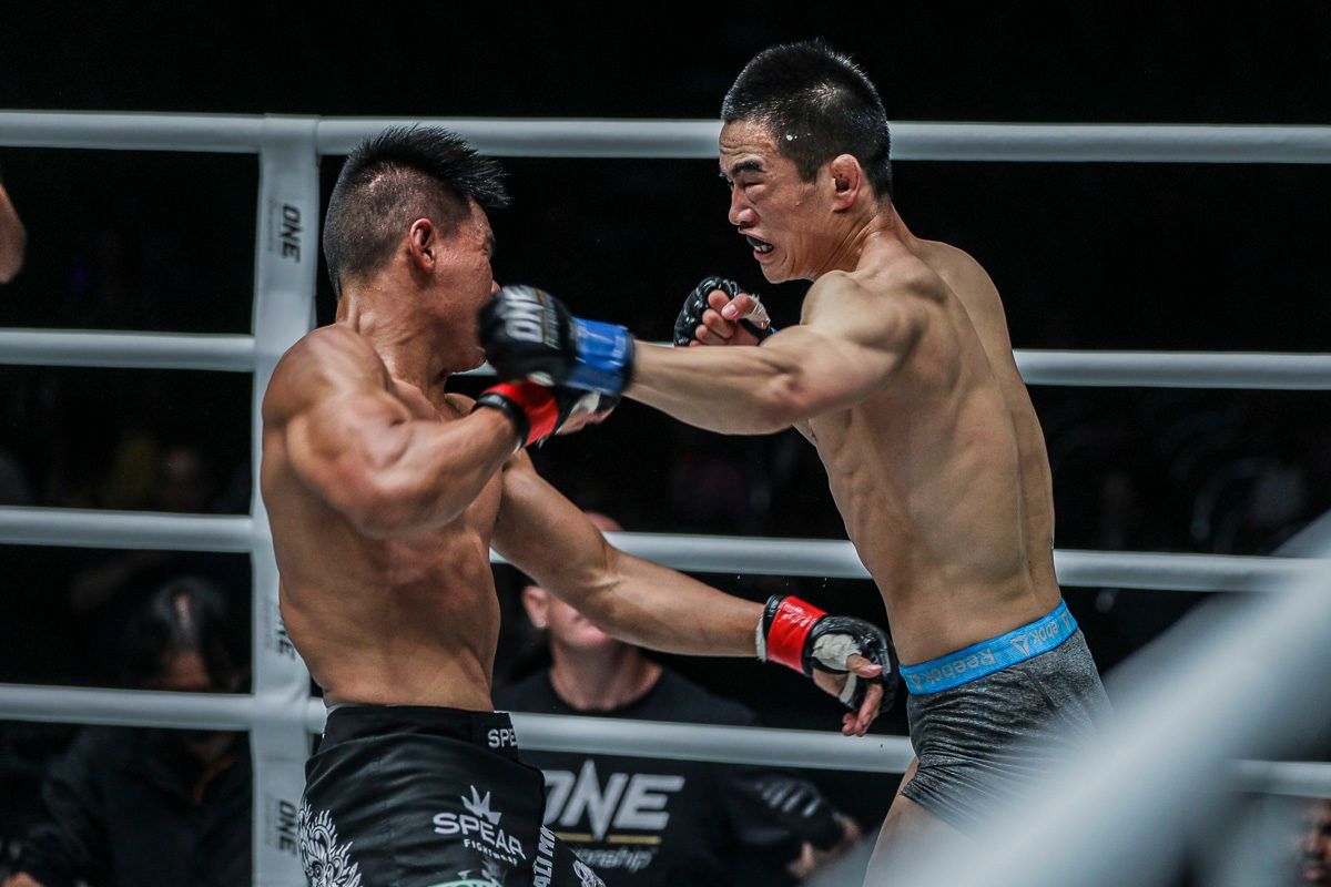 Chinese mixed martial arts Liu Peng Shuai throws a left hook