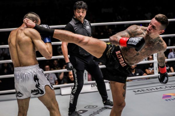 Dutch kickboxer Nieky Holzken throws a head kick