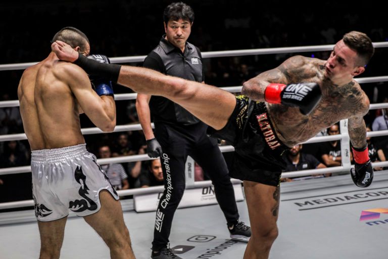 Dutch kickboxer Nieky Holzken throws a head kick