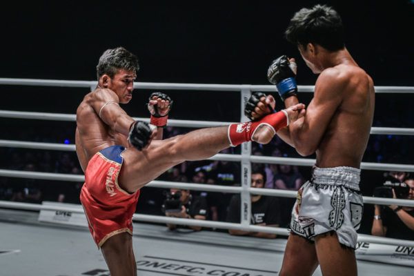 Muay Thai World Champion Superlek Kitmoo9 throws a roundhouse kick