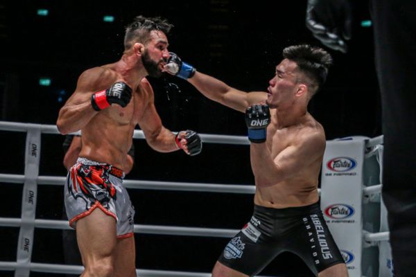 Japanese mixed martial artist Yoshiki Nakahara lands a jab of Emilio Urrutia