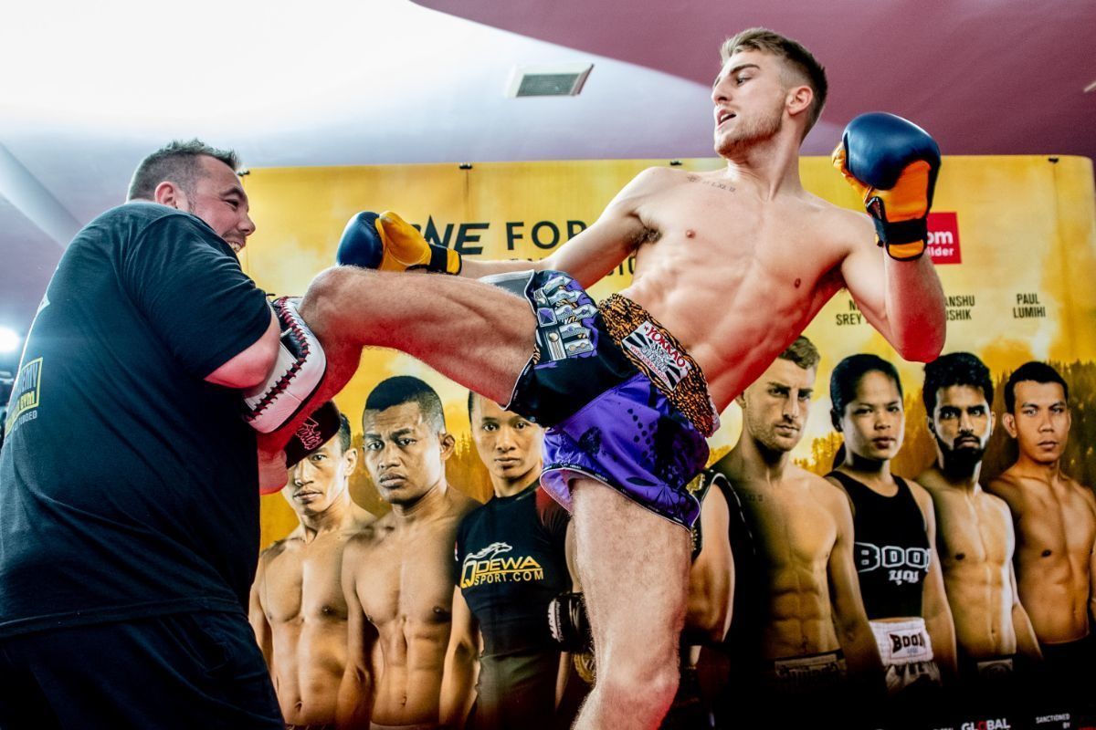 British striker Jonathan Haggerty kicks the pads during an open workout