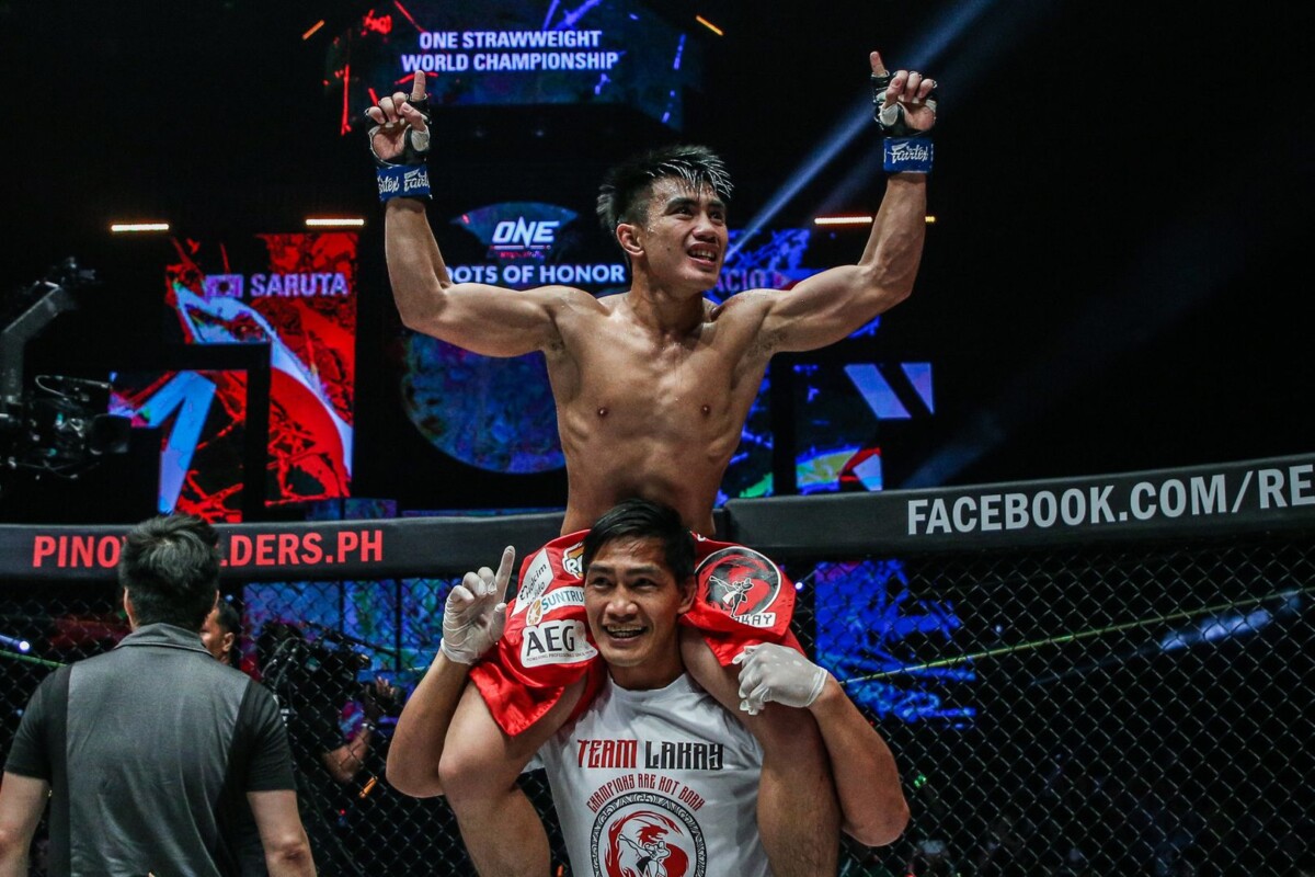 Joshua Pacio celebrates with Eduard Folayang