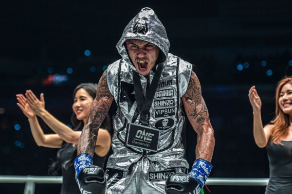 French-Algerian Muay Thai fighter Samy Sana celebrates his victory over Yodsanklai