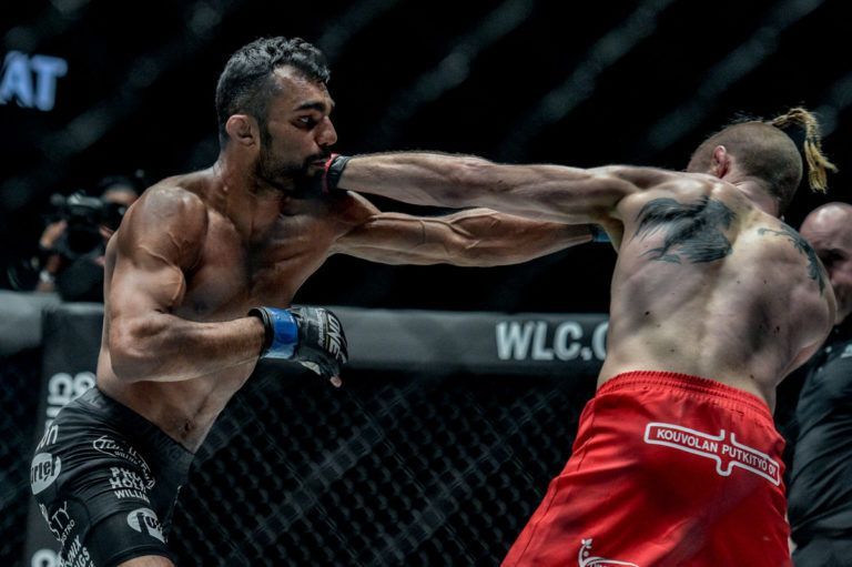Indian MMA fighter Gurdarshan Mangat punches Toni Tauru