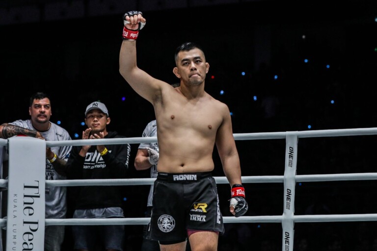 Ev Ting raises his arm in his native Malaysia
