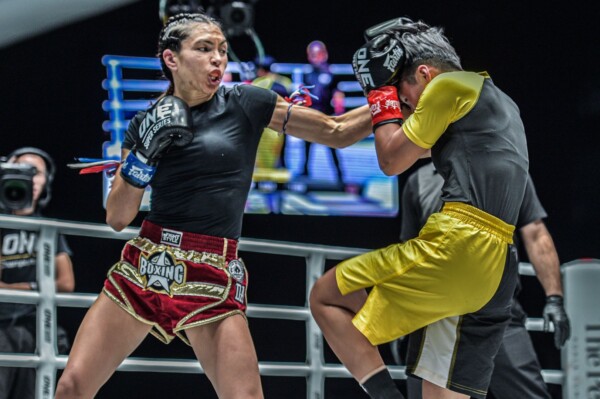 American kickboxer Janet Todd cracks former ONE Atomweight Kickboxing World Champion Chuang Kai Ting with a punch